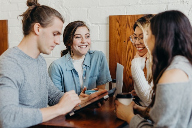 Team members discussing on a desk